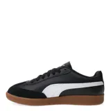 Championes Puma 9T W, color negro con detalles en blanco y suela marrón.