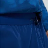 Pantalón deportivo Umbro del Club Nacional de Football, modelo Grok, color azul. Presenta el escudo del club en una pierna y el logo de Umbro en la otra.