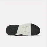Championes de entrenamiento Reebok Nano Gym, color verde militar con suela blanca y detalles en negro.