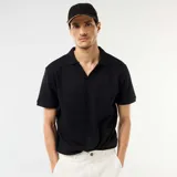 Remera de manga corta con cuello polo y escote en V, confeccionada en tejido con textura de nido de abeja.