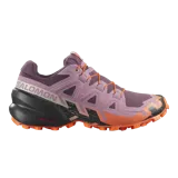 Championes de trekking Salomon Speedcross 6, color lila con detalles en naranja y suela negra con tacos para trail running.