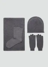 Guantes de punto de cachemira en color gris, con diseño clásico y puño elástico acanalado.