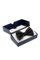 Moño de cuello azul oscuro con sutil estampado de pequeños puntos blancos, presentado en caja rígida.