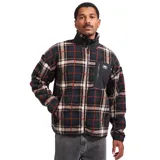 Campera de polar con cierre frontal completo y cuello alto. Presenta un diseño a cuadros en tonos oscuros con líneas rojas y blancas. Incluye un bolsillo frontal en el pecho con cierre y detalles en tela técnica negra.