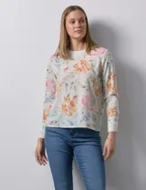 Blusa de gasa estampada con flores, marca Sioni. Manga larga con terminación de puño y botón.