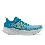 Championes de running New Balance modelo 1080 para mujer, color turquesa con detalles en blanco y verde.