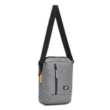 Bolso cruzado Caterpillar modelo Shoulder Bag, color gris medio, con correa ajustable negra y compartimento principal con cierre vertical. Presenta el logo CAT en la parte inferior frontal y una etiqueta amarilla con el nombre CATERPILLAR en el lateral.