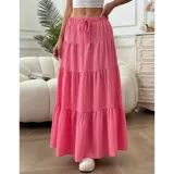 Falda larga acampanada de tiro alto, color rosado, con diseño en capas fruncidas y cintura elástica ajustable con lazo.