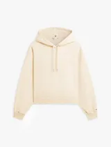 Buzo con capucha Tommy Hilfiger de corte amplio y hombros caídos, color beige. Cuenta con cordón ajustable, puños y bajo de punto canalé, y el logo de la marca bordado en el pecho.