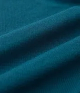 Blusa tipo muscle tee color turquesa, con cuello redondo y diseño sin mangas. Confeccionada en tejido rib acanalado.