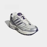 Championes Adidas Adistar Control 3 de running, color blanco con detalles plateados y violetas. Cuentan con exterior de malla y refuerzos sintéticos, estructura de TPU y suela de caucho.