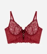 Soutien tipo bralette alargado de encaje floral color bordó, con escote en V profundo, breteles finos ajustables y detalle de argollas metálicas en el centro.