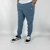 Pantalón de jogging azul jean con puños ajustados en los tobillos y logo bordado en blanco.