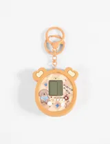 Llavero con forma de consola de juegos retro con diseño de cachorros.