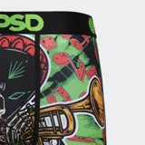 Calzoncillos bóxer de hombre PSD con estampado de esqueleto mariachi sobre fondo verde con notas musicales. Cuenta con pretina elástica negra con logo de la marca en verde, entrepierna de 7 pulgadas y bolsa MicroMesh transpirable.