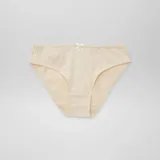 Pack de siete bombachas de algodón con diseños variados, incluyendo estampados de vaquitas de San Antonio, flores y colores lisos, todas con un pequeño lazo decorativo en la cintura.