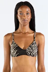 Top de bikini con tirantes finos regulables, con estampado animal print tipo cebra en tonos negro y beige.