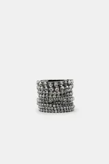 Pack de pulseras elásticas plateadas con apliques de strass de diferentes tamaños.