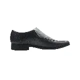 Zapato de vestir negro de cuero, con punta fina y suela de goma.