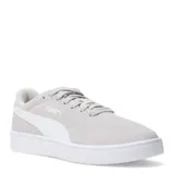Championes urbanos Puma modelo Court Lally SD, color gris claro con detalles en blanco. Confeccionados en gamuza con suela de goma blanca y logo de la marca en el lateral.