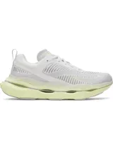 Championes de running Under Armour modelo Halo Racer, color blanco con detalles en amarillo neón. Presentan una entresuela de espuma HOVR+ con diseño de balancín, malla superior para ventilación y suela de goma duradera.