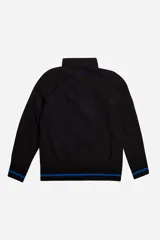 Campera de nylon azul marino, resistente y liviana, con cuello y cintura en rib marrón. Presenta logo en grifa de goma y puños con rib a tono.