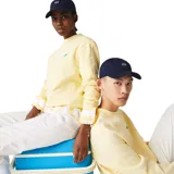 Gorra de béisbol Lacoste color azul marino, con el logo del cocodrilo bordado en el frente.