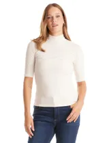 Remera de tejido rib marca Elie Tahari, color beige, con cuello mock y mangas cortas. Presenta un pequeño avío metálico con logo en el ruedo.