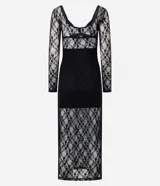 Vestido midi de encaje negro con mangas largas, escote en V estructurado y detalle de recorte tipo corset en el torso. La falda presenta un diseño con transparencia y caída fluida.