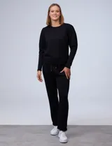 Buzo gris claro de jersey, marca Nanette, con cuello redondo y mangas largas abullonadas con detalle de pinzas en los hombros.