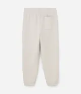 Pantalón jogger de algodón con felpa, color beige, con cintura elástica, cordón ajustable, bolsillos laterales y puños elásticos en los tobillos.