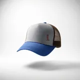 Gorra tipo trucker con frente gris, visera azul y paneles traseros de malla marrón. Presenta un pequeño bordado decorativo en el panel frontal.