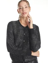 Cardigan negro de manga larga con lentejuelas bordadas, cuello redondo y cierre frontal con botones metálicos. Presenta puños y bordes acanalados.