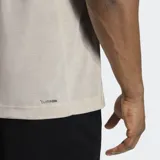 Remera Adidas Workout Essentials Feelready de color gris melange, con diseño clásico de manga corta y cuello redondo. Cuenta con el logo de la marca estampado en el pecho en color negro y tecnología de absorción de humedad.