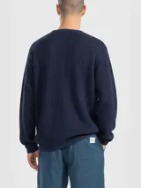 Sweater de algodón negro con diseño de tejido calado, cuello redondo y manga larga.