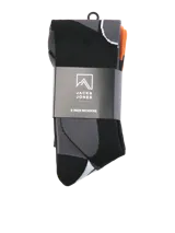 Medias deportivas extra largas diseñadas para ski, en color gris oscuro con detalles geométricos en naranja y franjas violetas en la planta del pie. Confeccionadas en tejido de punto elástico.
