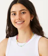 Top cropped musculosa de mujer, color marrón oscuro, confeccionado en tejido ribana acanalado, con cuello redondo y sin mangas.