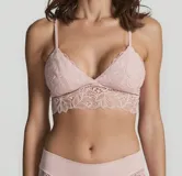 Bralette de encaje rosado con breteles finos regulables y espalda con cierre de gancho.