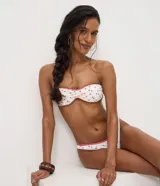 Top de bikini bandeau de microfibra, con diseño de estampa de hongos y detalles de ribete con estampado a cuadros en los bordes.