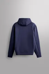 Campera canguro de Zara Athleticz, modelo relaxed fit, confeccionada en tejido técnico compacto elástico con mezcla de algodón en color azul marino. Cuenta con cuello subido con capucha, manga larga con bolsillo lateral con cierre, bolsillos frontales con cierre y acabado termofijado, cierre frontal de doble dirección y logo estampado en el bajo.