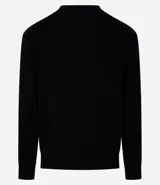 Suéter negro de punto con cuello redondo y mangas largas. Diseño con líneas horizontales en relieve.