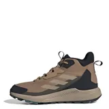Championes de trekking Adidas Terrex Anylander Mid, de caña media, color marrón con detalles en negro. Presentan diseño robusto con refuerzos en la puntera y talón, cordones ajustables y suela con relieve para mayor tracción.