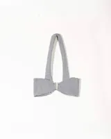 Top strapless de corte ajustado con estampado de cuadros vichy en blanco y negro. Presenta un cierre frontal con gancho metálico y un cuello tipo choker integrado en la misma tela.