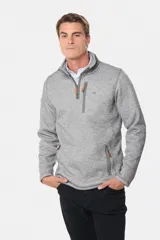 Buzo de felpa con interior de polar, diseño de medio cierre frontal, cuello alto y bolsillos laterales y en el pecho con cierres.