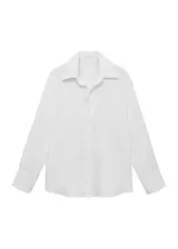 Camisa blanca oversize de lino, con cuello camisero, manga larga con puños abotonados y cierre frontal con botones.