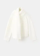 Chaleco largo de punto color blanco marfil, con diseño abierto y superpuesto de estilo versátil.