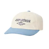 Gorra de gabardina color crema con visera curva azul y logo de Rip Curl bordado en el frente.