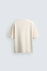 Sudadera de manga corta con corte relajado, confeccionada en tejido interlock de algodón con elasticidad y cuello redondo.