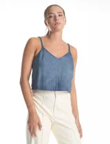 Top corto de denim azul con apliques de strass en toda la superficie. Presenta escote en V, breteles finos y espalda abierta con ajuste mediante lazos.
