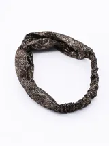 Vincha elástica de tela negra con acabado brillante metalizado y detalle de nudo frontal.